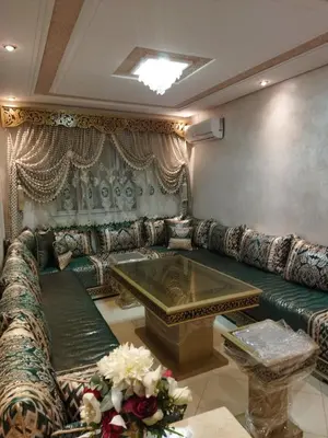 a living room with a couch and a table at Appartement meublé fes in Fès