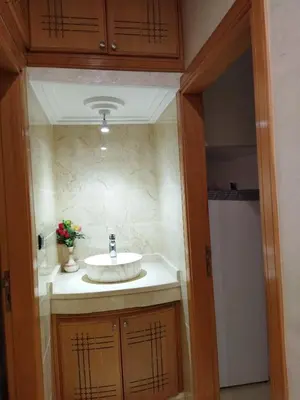 a bathroom with a sink in a room at Appartement meublé fes in Fès