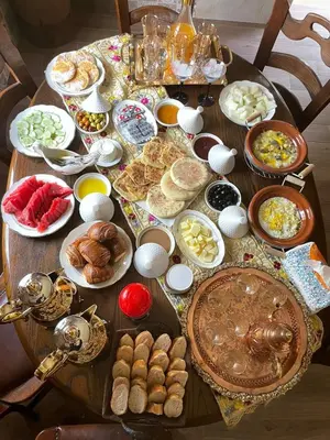 a table with a bunch of food on it at Riad Marjana in Marrakech