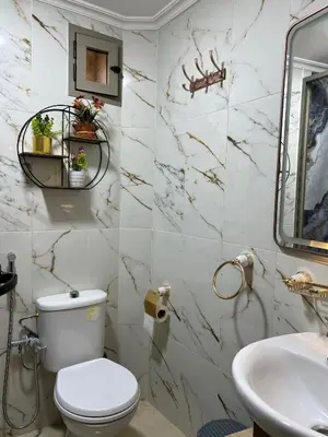 a bathroom with a toilet and a sink at Appartement Authentique à la Médina de Fès - À Deux Pas de Bab Bou Jeloud & des Souks in Fès al Bali