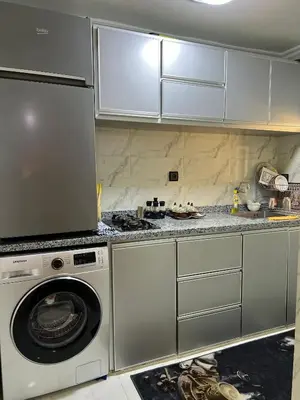 a kitchen with a washer and a washing machine at Appartement Authentique à la Médina de Fès - À Deux Pas de Bab Bou Jeloud & des Souks in Fès al Bali