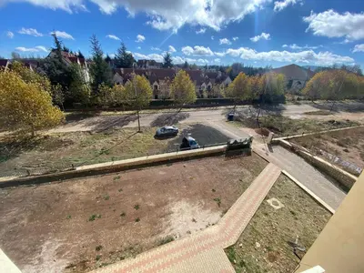 an aerial view of a park with a road at Cedar Peak Residence in Ifrane
