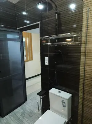 a bathroom with a white toilet in a room at Superbe maison près de la gare de train in Fès