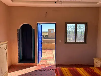 an open door in a room with a window at Dar Tiniri - Guest House - Zagora in Arhla Ou Drar