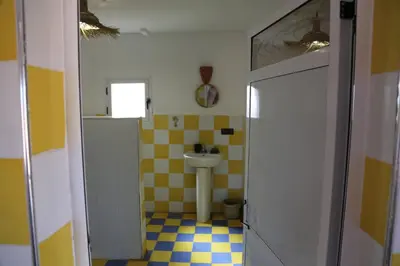 a bathroom with a sink and a toilet at Dar Tiniri - Guest House - Zagora in Arhla Ou Drar