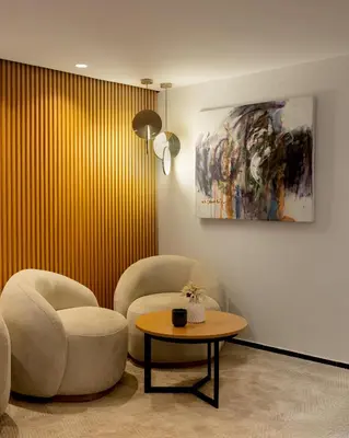 a living room with two chairs and a table at MIA Urban Fès in Fès