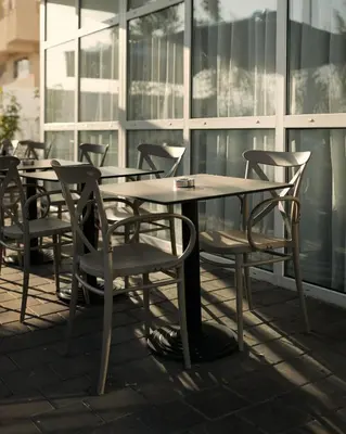 a group of tables and chairs on a patio at MIA Urban Fès in Fès