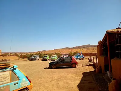 a group of cars parked in a parking lot at Auberge Dar Lajdoud in Tafraoute Sidi Ali