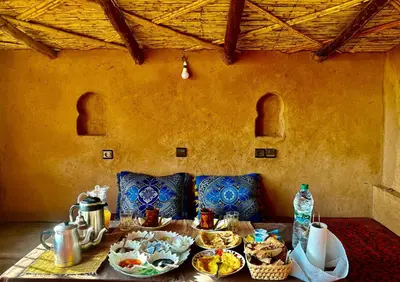 a table with plates of food on top of it at Auberge Dar Lajdoud in Tafraoute Sidi Ali