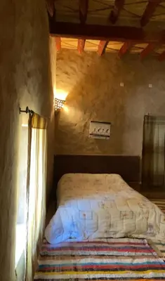 a bedroom with a bed in a room at Maison Chez Lahcen - Akka Nait Sidi - Tissint in Tissint