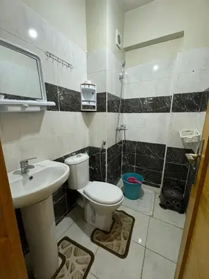 a bathroom with a toilet and a sink at Chambre Auberge in Fès