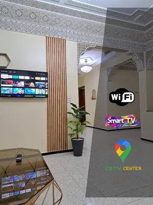 a lobby of a city center with a sign on the wall at Appartement Atlas City Center in Fès