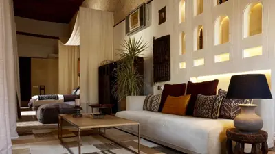 a living room with a couch and a table at Karawan Riad in Fès