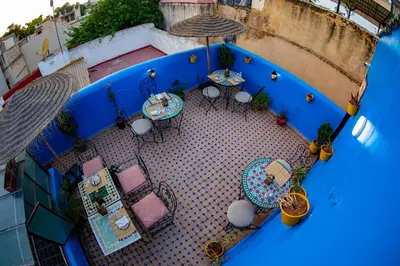 an overhead view of a patio with tables and chairs at Riad LalaMoune in Fès
