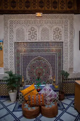 a room with a wall with a tile wall at Riad LalaMoune in Fès