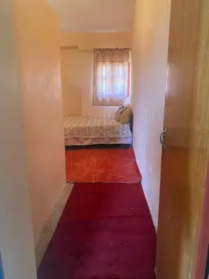a small room with a bed and a window at Gite Cèdre Gouraud in Azrou