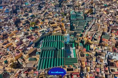 an overhead view of a city with a green building at Appartement Centre Ville - ATLAS in Fès