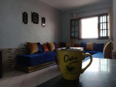a coffee cup sitting on a table in a living room at Luxury Ifrane House in Ifrane