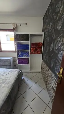 a bedroom with a bed and an open closet at Luxury Ifrane House in Ifrane