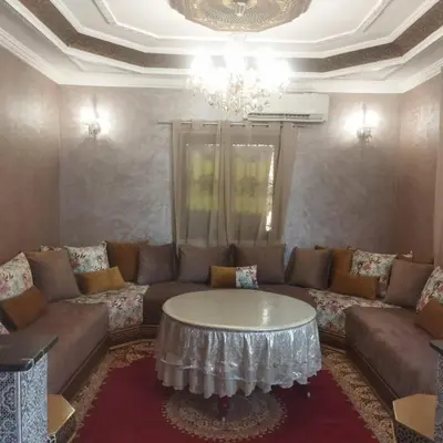 a living room with a couch and a table at Chez Sondos in Marrakech