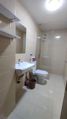 a bathroom with a sink and a toilet and a shower at Coin vert in Fès