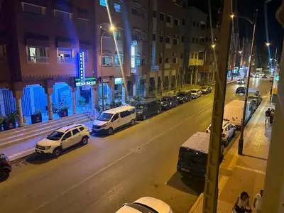 a city street at night with cars parked at 800 Miles of Travel in Ouarzazate