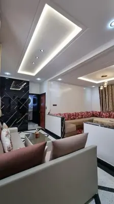 a lobby with couches and chairs in a building at Spacieux Appartement in Azrou