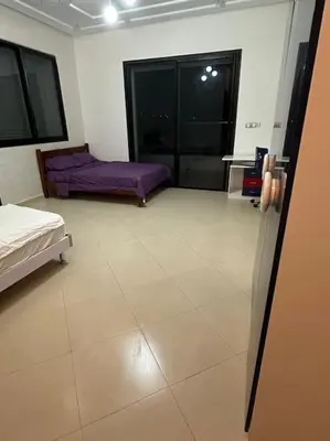 a room with a bed and a couch in it at Super belle villa avec piscine in Fès