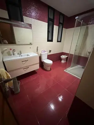 a bathroom with a toilet and a sink and a shower at Super belle villa avec piscine in Fès