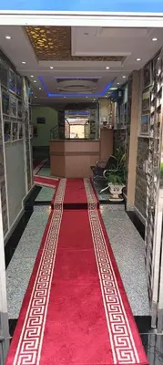 a red carpeted hallway with a red carpet at APPART-HOTEL La MAISON ATTAWBA 2 in Beni Mellal