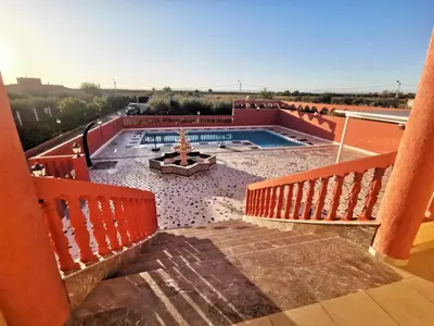 a view from the balcony of a house with a pool at Villa des Oliviers MEKNES in Meknès