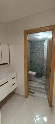 a bathroom with a sink and a toilet in it at APPART-HOTEL La MAISON ATTAWBA 3 in Beni Mellal