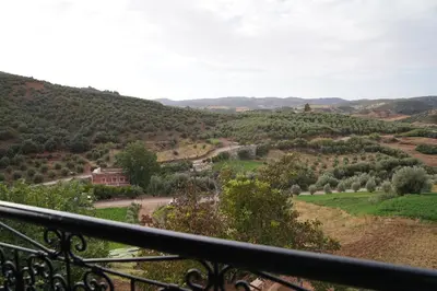 a view of a valley from the balcony of a house at Gite Marbie maison rurale, une expérience naturelle unique, au coeur du moyen atlas, Maroc in Teklit