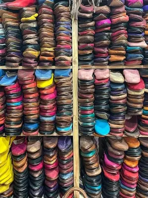 a shelf filled with lots of different types of hats at Nabiloc Apart Hotel - Centre Ville in Fès