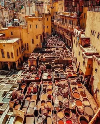 a street filled with lots of vases on the ground at Nabiloc Apart Hotel - Centre Ville in Fès
