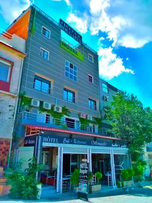 a building with a hotel sign on top of it at Hotel Restaurant Bougafer in Midelt