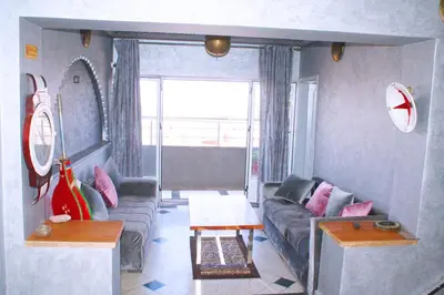a living room with a couch and a table at Hotel Restaurant Bougafer in Midelt
