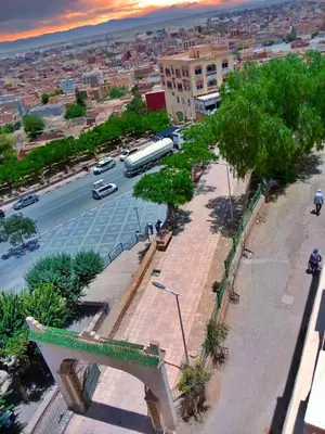 a view of a city with a bus on a street at Hotel Restaurant Bougafer in Midelt