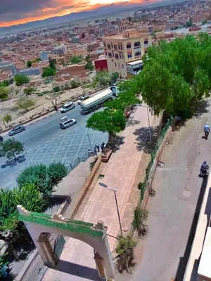 a view of a city with a bus on a street at Hotel Restaurant Bougafer in Midelt