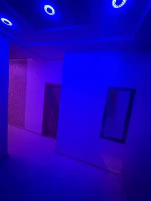 a room with blue and purple lights on the ceiling at Appartement fes magnifique in Fès