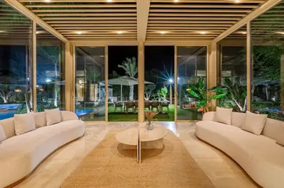 a living room with white couches and a coffee table at Villa Bahamas , Luxe et élégance & piscine Chauffée, jacuzzi in Marrakech