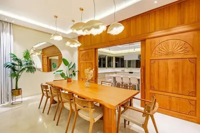 a dining room with a wooden table and chairs at Villa Bahamas , Luxe et élégance & piscine Chauffée, jacuzzi in Marrakech