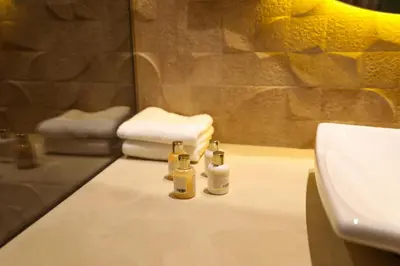 a bathroom sink with two bottles on a counter at Villa Rubis in Marrakech