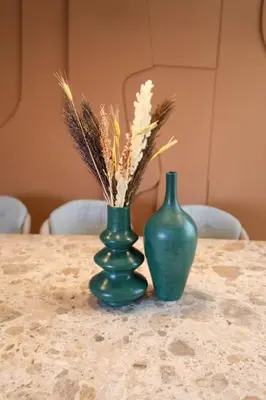 two green vases sitting on top of a table at Villa Rubis in Marrakech