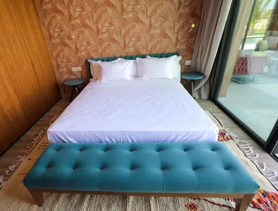 a bedroom with a bed and a blue couch at Villa Rubis in Marrakech