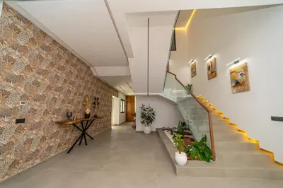 a hallway with stairs and a brick wall at Villa vue atlas marrakech in Marrakech