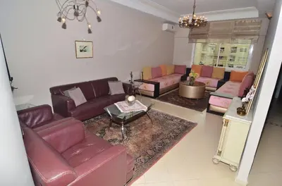 a living room with couches and a table at Appartement au coeur de Fès in Fès