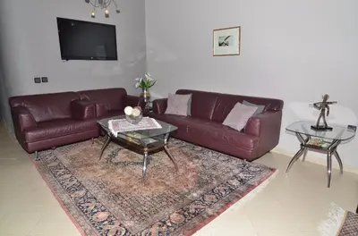 a living room with a couch and a table at Appartement au coeur de Fès in Fès