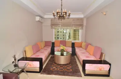 a living room with a couch and a table at Appartement au coeur de Fès in Fès