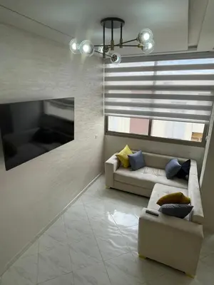 a living room with a couch and a window at Housse Fez City in Fès
